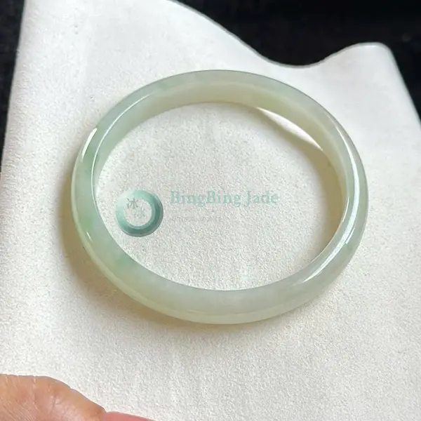 Pale Spring Mist Jadeite Bangle 57.7mm — Soft Glow with Delicate Green Wisps