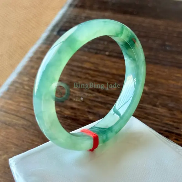 Icy Spring Float with Emerald Drift — Oval Bangle 53.4mm