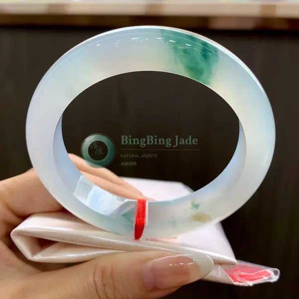 Icy Veil with Floating Emerald Bloom — Jadeite Bangle 56.5mm