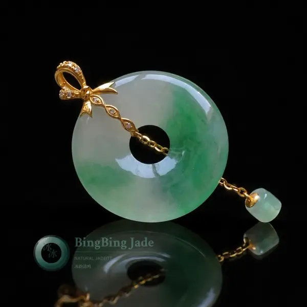 Icy Spring Green Jadeite Donut Pendant with 18K Gold Bow Bail