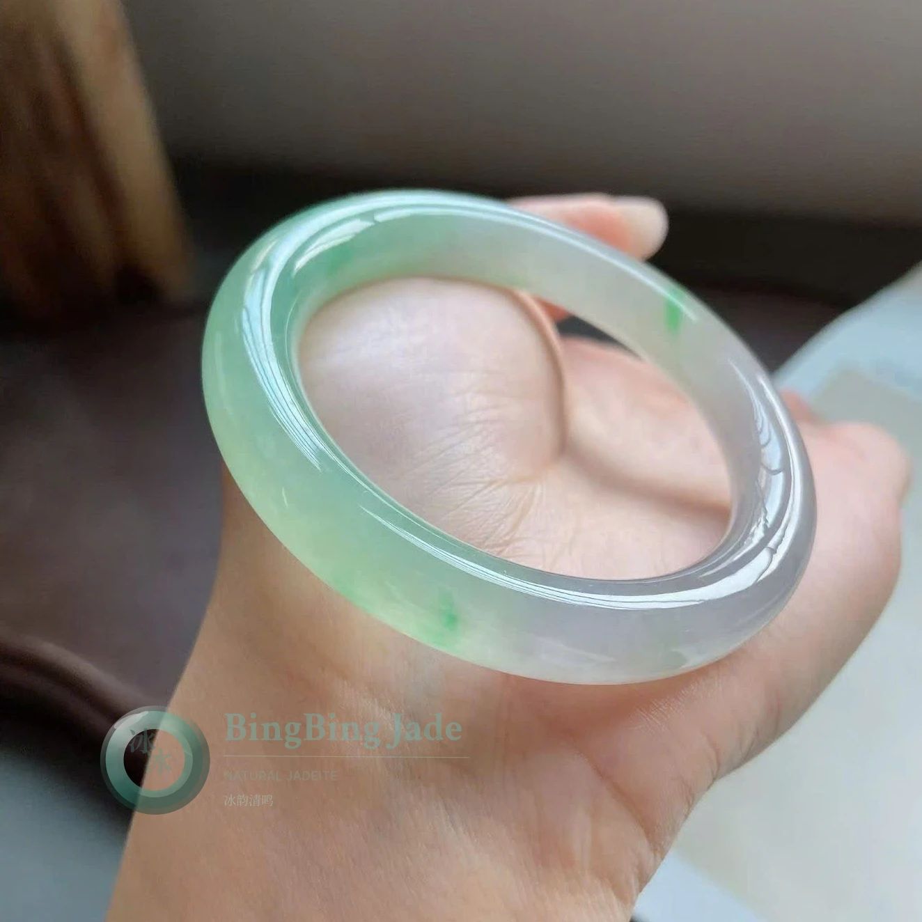 Soft Spring Glow with Floating Green Wisps — Jadeite Bangle 49mm