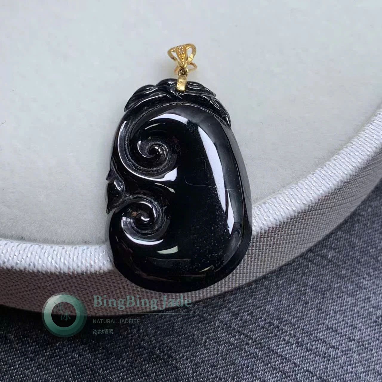 Ink-Black Ruyi Carved Jadeite Pendant with Gold Bail