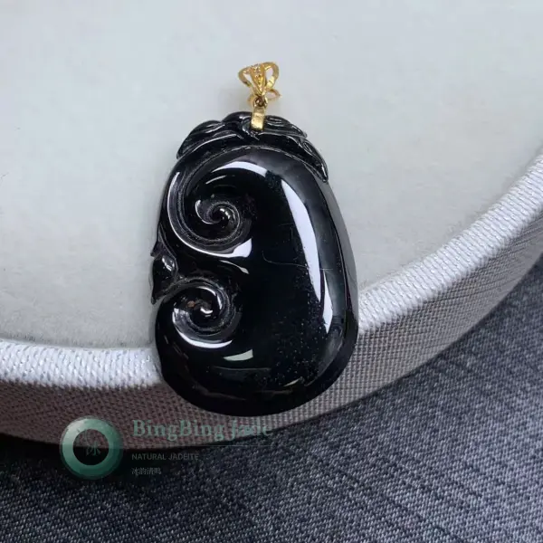 Ink-Black Ruyi Carved Jadeite Pendant with Gold Bail
