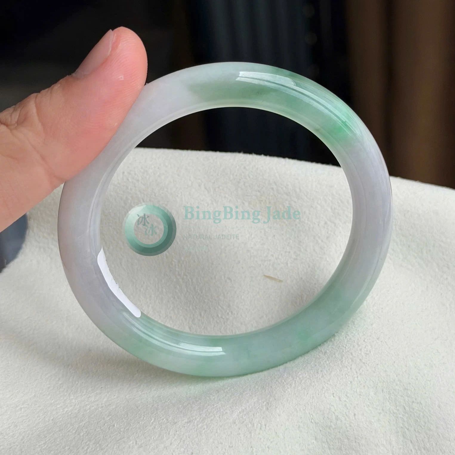 Pure White Canvas with Floating Green Bloom — Bản Đũa Bangle 59mm