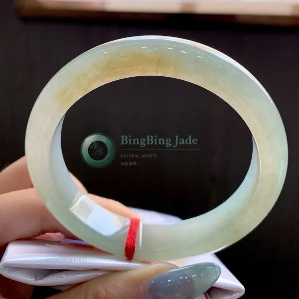 Honey-Kissed Celadon Jadeite Bangle 57mm — Warm Glow on Soft Ice