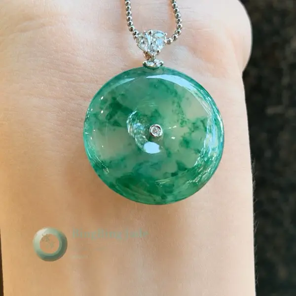 Icy Jade Donut Pendant with Floating Emerald Blooms