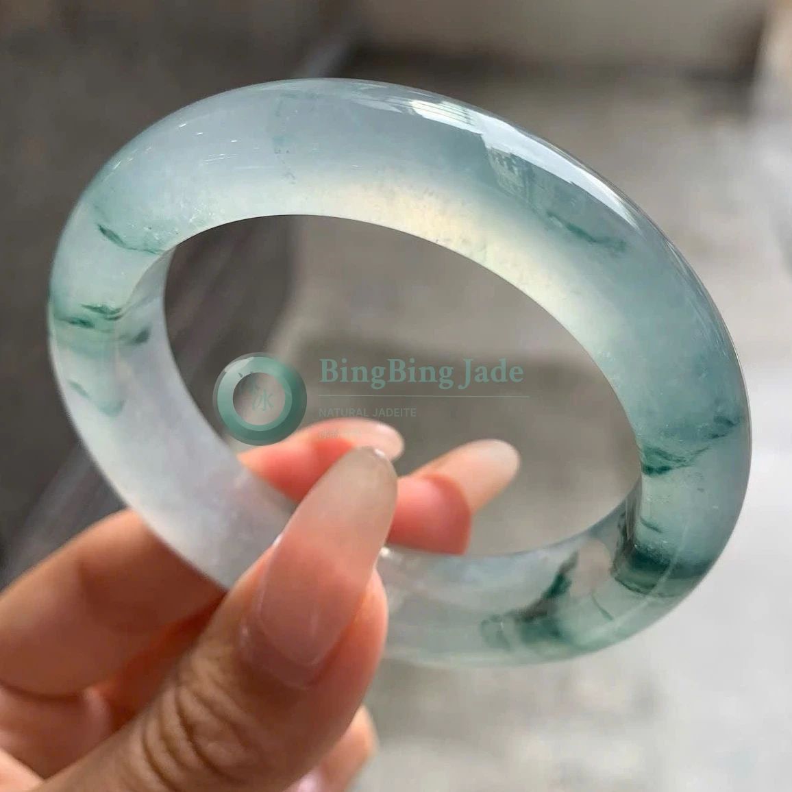High Icy Aqua Jadeite Bangle with Floating Emerald Wisps