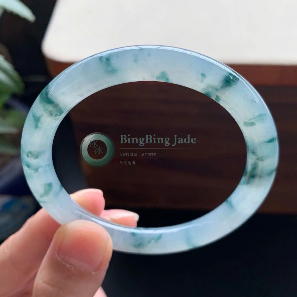 Icy Floating Emerald Bangle — Drifting Green Blooms on Blue Glass