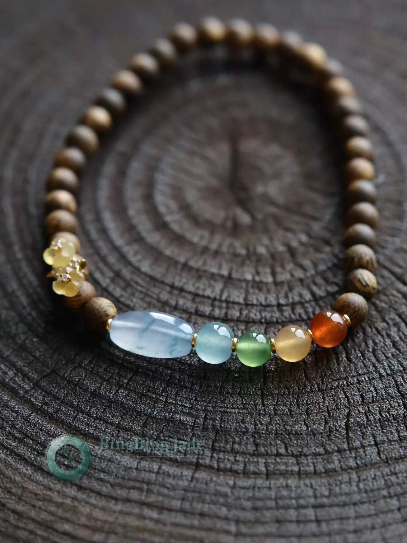 Icy Multi-Treasure Jadeite & Agarwood Bracelet — Gradient Warmth on Dark Wood