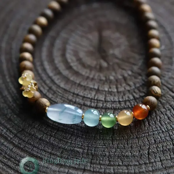 Icy Multi-Treasure Jadeite & Agarwood Bracelet — Gradient Warmth on Dark Wood