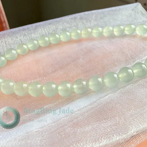 High Icy Dewdrop Jadeite Bead Bracelet with Floating Emerald Accent